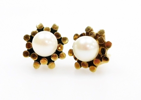 A pair of 9ct gold cultured pearl earrings, with abstract floral design and central cultured pearl with single pin and butterfly backs, 3.4g all in, boxed.