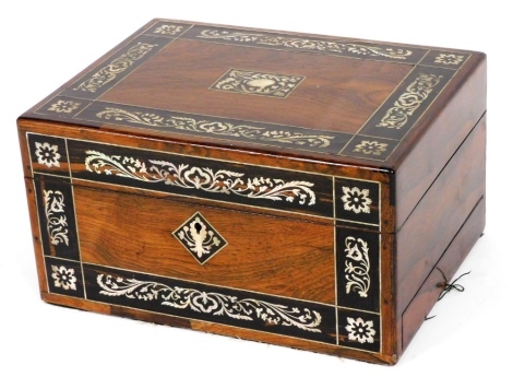 A Victorian rosewood and mother of pearl inlaid travelling box, decorated with flowers and scrolling leaves, the hinged lid opening to reveal a fitted interior containing various jars, boxes and bottles, with semi secret side drawer, 17cm high, 31cm wide,