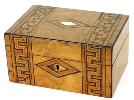 A Victorian walnut work box, with satinwood cross banding and mother of pearl inlaid cartouches and Greek key bands, the hinged lid opening to reveal a fitted tray, 11cm high, 24cm wide, 13cm deep.