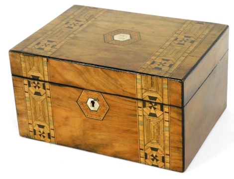 A Victorian walnut and inlaid jewellery box, with fitted interior, elaborate mother of pearl escutcheon and banded inlay with octagonal motifs, 15cm high, 26cm wide, 15cm deep.