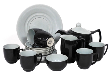 A Branksome china black and turquoise part tea service, printed mark, comprising teapot, cream jug, sugar bowl, bread plate, six tea cups, seven saucers, and six tea plates.