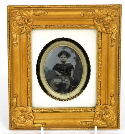 A Victorian daguerreotype photograph of a young girl, inscribed to reverse 'This Portrait of Ann Blore Was Taken On The 6th May 1857 At The Age of Four Years and Five Months', within a gilt frame.