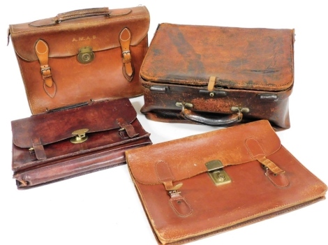 A late 19thC Arthur Barber leather bag, bearing label for 56 Market Street, Bradford, 41.5cm wide, together with three early 20thC leather briefcases, with brass locks. (4)