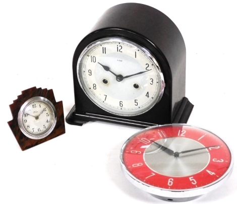 A Smith's Enfield mantel clock, in domed Bakelite case, with 14cm diameter Arabic dial and eight day movement, a further Art Deco Anvil Perivale travel clock, and a Metamec retro wall clock. (3)