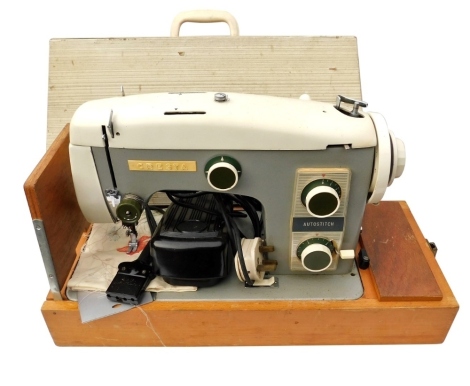 A Cresta vintage auto stitch electric sewing machine, two tone in cream and grey, cased. Buyer Note: WARNING! This lot contains untested or unsafe electrical items. It is supplied for scrap or reconditioning only. TRADE ONLY