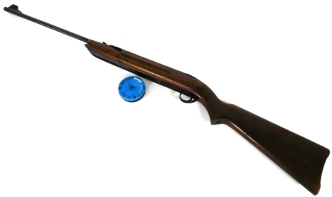 A B.S.A .22 calibre air rifle, with walnut stock, 112cm long.