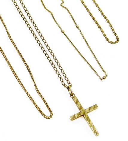 A group of yellow metal necklaces and a cross, each stamped 9kt, the cross fully hallmarked, 16.2g all in.