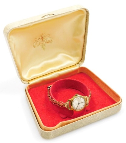 A Summit lady's wristwatch, with gold coloured strap and articulated clasp, boxed.