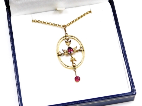 An Art Nouveau garnet and seed pearl pendant and chain, set with garnets and seed pearls, yellow metal, indistinctly stamped 9ct.