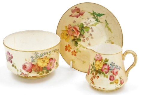 Three items of Royal Worcester blush porcelain, comprising saucer, 12.5cm diameter, sugar bowl (AF) 10cm diameter, and milk jug, 6.5cm high, all floral decorated with gilt highlights.