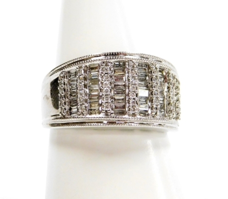 An Iliana 18ct white gold and diamond ring, pave set with twelve rows of alternating baguette and brilliant cut diamonds, size T, 10.2g.all in.