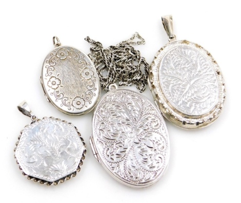 Four silver locket pendants, and one chain, three oval examples, one Victorian marked ML162 Golden Galleon WTC, two further floral examples, and a octagonal floral design locket, 54.8g all in.