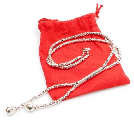 An Uno de 50 white metal necklace, entitled 'All Balls Long Necklace', white metal stamped 925, the necklace 72cm long, with pendant drop, 134.2g all in.