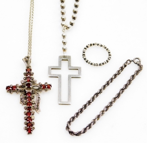 A group of silver and other jewellery, comprising a silver rope twist bracelet, 16cm long, a silver love heart dress ring, a white metal Old Florence crucifix pendant and chain stamped 925, the chain 40cm long, and a further white metal and garnet set cru