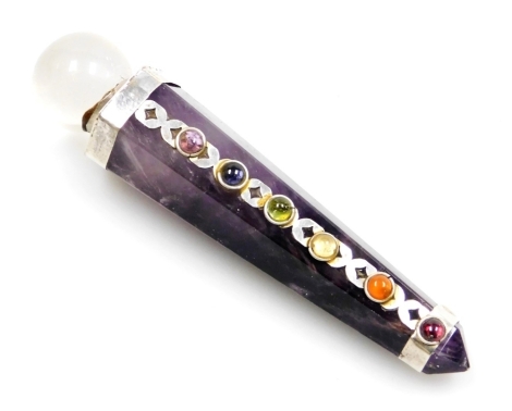 An amethyst stone chakra stick, or healing wand, with white metal applied caps and semi precious stone band, with clear crystal top, 9cm high.