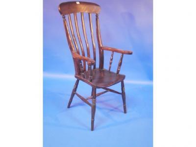 A Victorian grandmother chair with lath back