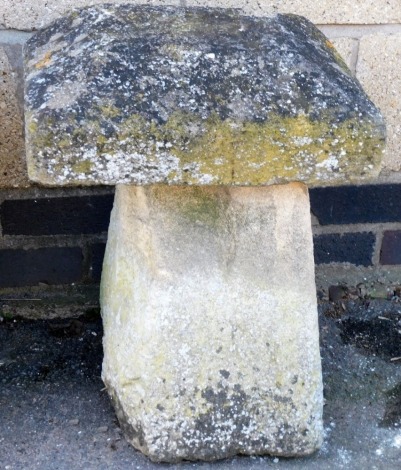 A staddle stone, of square form, with tapering cap and base, 52cm high, 37cm wide.