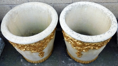 A pair of Willowstone composition garden pots, each decorated with scrolls, cartouches, etc., later painted in gilt, 49cm high.