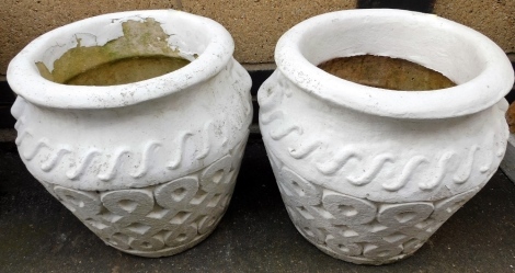 A pair of composition garden pots or planters, each with a stylised wave border and side handles, with a broad geometric band, later painted white, 48cm high, 42cm wide.