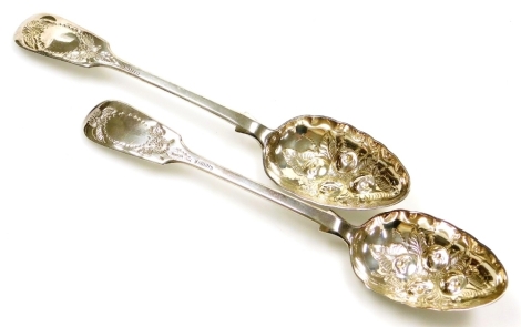 A pair of Victorian Scottish silver fiddle pattern serving spoons, each bowl with fruit decoration, Edinburgh 1843, 23cm long, 4¾oz.