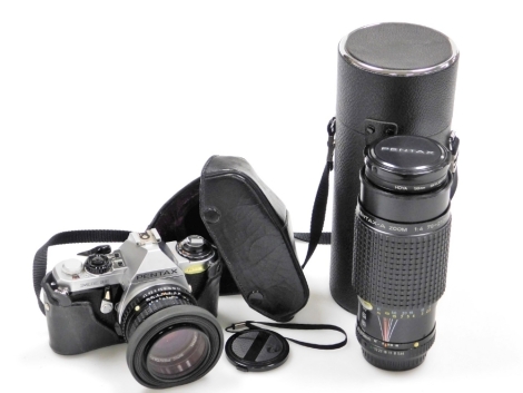 A Pentax ME Super camera, with 50mm lens and hood, with case, and an SMC Pentax A zoom 1.4 70x210mm lens, in leather case. (2)