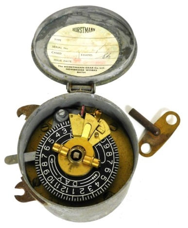 A Horstmann vintage timer switch, in a galvanized metal case, with key, 9cm diameter.