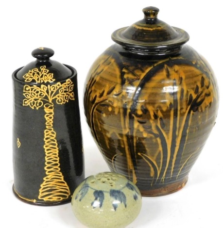 A Douglas Fitch and Hannah McAndrew studio pottery jar and cover, 29cm high, a Hannah McAndrew jar and cover, decorated with a stylised tree, 25cm high, and a Leslie Bean pot pourri. (3)