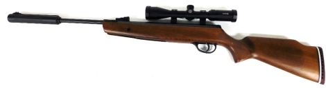 A Hatsan Edgar Brothers Striker air rifle, with beech stock and Hawke rifle scope, 103cm long.