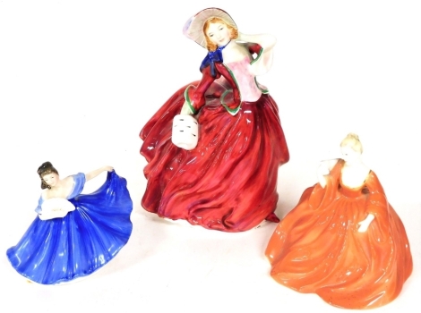 Two Royal Doulton figures, Autumn Breezes, Elaine, and a Coalport figurine Natalie. (3)