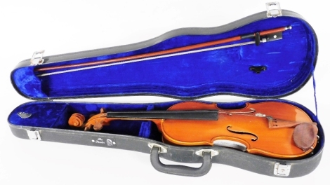 A Stentor student or child's violin, with a bow, length of back 30.5cm.