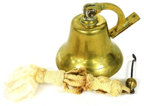 A brass ship's bell, with curved arm suspension, 17cm diameter.