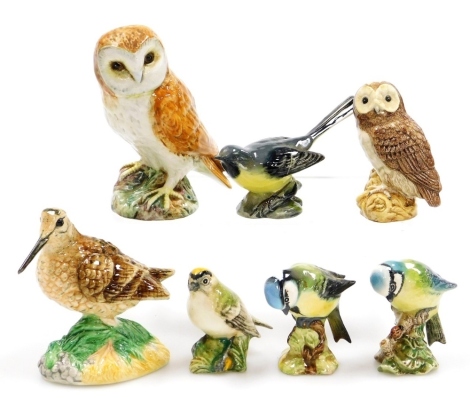 A group of Beswick and John Beswick birds, to include a Woodcock, Owl, Blue Tit, Grey Wagtail, etc. (7)