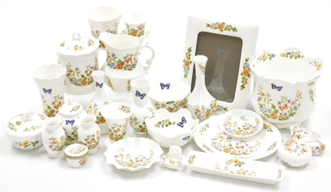 Aynsley Cottage Garden wares, to include a jardiniere with a flared rim, 17cm high, picture frame, lidded jar, vases, dishes, plates, etc., printed marks. (a quantity)