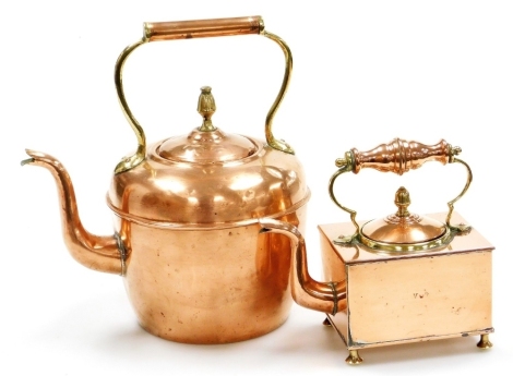 A Victorian copper and brass rectangular kettle, on bun feet, 20cm high, and a copper and brass kettle of conventional form. (2)