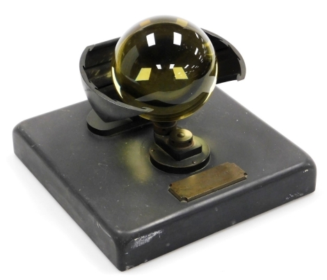 A Campbell Stokes sunshine recorder, with bronzed metal mounts, on a black slate base, mounted with a plaque for the maker, Lennies, 46 Princes Street, Edinburgh, 22cm wide.