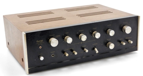 A Sansui solid state stereo amplifier, model number AU-666, in a teak case, 42cm wide.