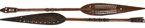 Tribal art. A pair of African hardwood souvenir paddles, 160cm long.