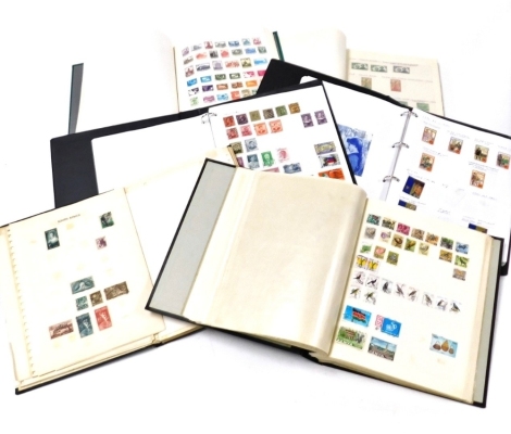 Six albums of world stamps, to include India, South Africa, Afghanistan, two albums of New Zealand stamps, Mexican stamps, etc.