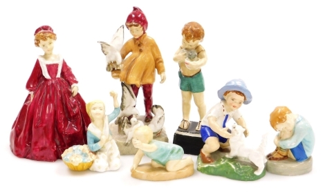 A group of Royal Worcester porcelain figures, some possibly prototypes, chiefly modelled by Freida Doughty, comprising a crouching boy, Michael 2912, girl with flowers named as Doris, boy with a cat September Boy, another with a kitten Friday's Child, gir