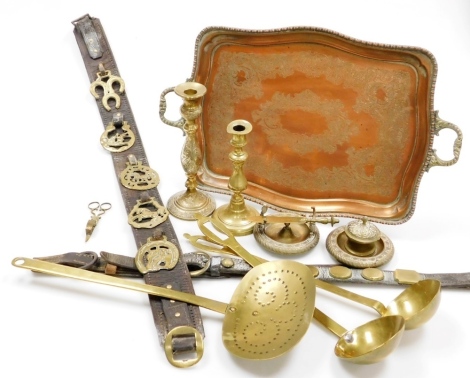 Copper and brass wares, to include rectangular two handled tray, a skimmer, ladles, leather martingales, etc. (a quantity)