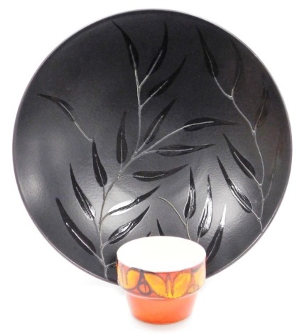 A Poole jet charger, decorated with leaves, and a Delphis planter, number 72, 12cm diameter.