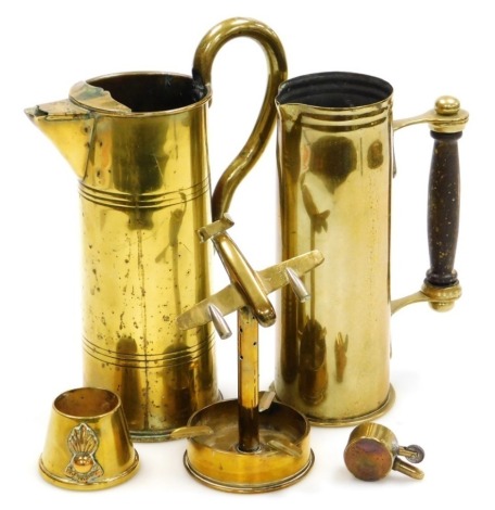 Various trench art brassware, comprising a World War I shell case jug, 24cm high, Royal Engineers match holder, further jug, and a pocket lighter inset British and French coins, together with a WWII shell case converted to an ashtray surmounted with a bom