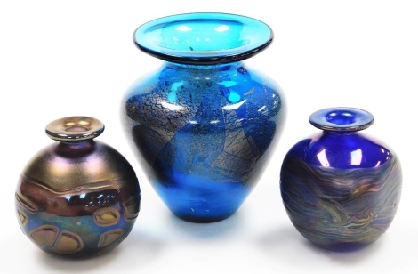 A Phoenician multi coloured glass iridescent globular vase, 8cm high, another similar square section vase, and a larger turquoise vase with gold inclusions, unmarked, possible Mdina, 13cm high. (3)