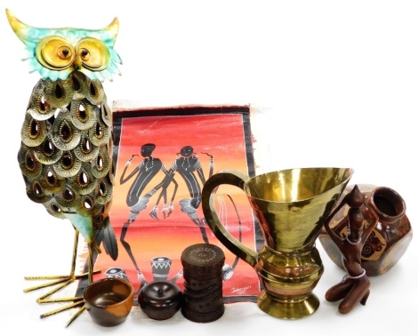 A group of collectables, to include a late 19th/early 20thC turned wooden box and cover, a tribal figure, a vase signed Isabel Norori, a metal owl with articulated head, a tribal brass and copper ewer, an African tribal picture, etc. (a quantity)