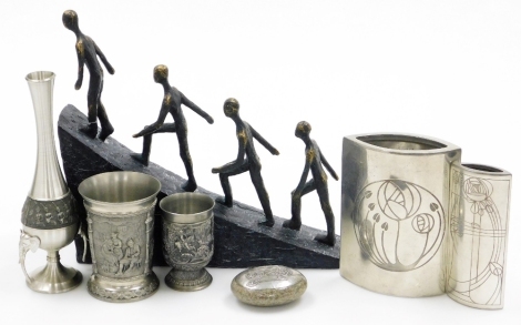 A collection of pewter and other metalware, comprising a German beaker decorated with pastoral scenes, hunting cup, Chaopraya vase with elephant's head handles, two Charles Rennie Mackintosh inspired vases and a mounted stone, and a fibreglass sculpture o