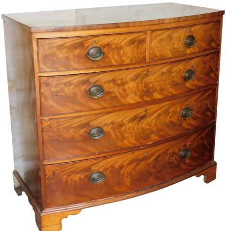 A George III mahogany bow fronted chest of two short over three long drawers, raised on bracket feet, 100cm high, 106cm wide, 55cm deep.