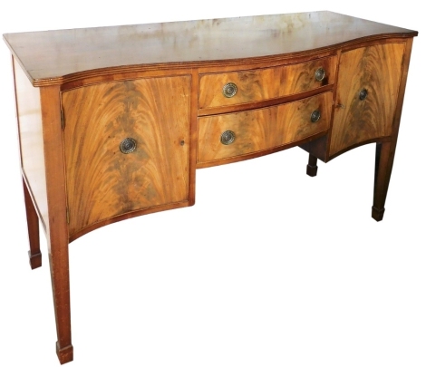 A 20thC flame mahogany serpentine sideboard, centred by two drawers flanked by cupboards, on square tapering legs terminating in spade feet, 93cm high, 152cm wide, 60cm deep.