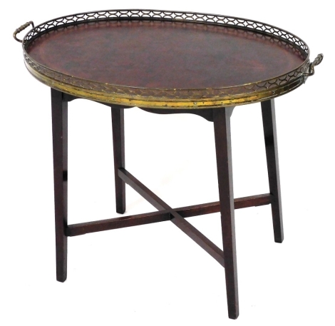 A 19thC marquetry serving table, with brass pierced gallery raised on square tapering legs joined by an X framed stretcher, 52cm high, 65cm wide, 41cm deep.