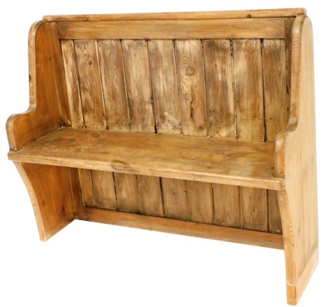 A pine settle with slatted back, on shaped stiles, of small proportion, 93cm high, 118cm wide, 41cm deep, (AF).