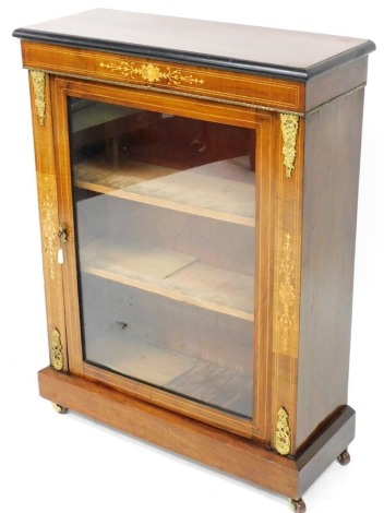 A Victorian mahogany boxwood strung and marquetry pier cabinet, the top with an ebonised border above a glazed door, on turned feet, 101cm high, 76cm wide, 29cm deep.